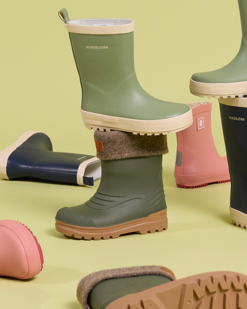 Fargerike gummistøvler i ulike størrelser med teksten 'NORDBJÖRN'.